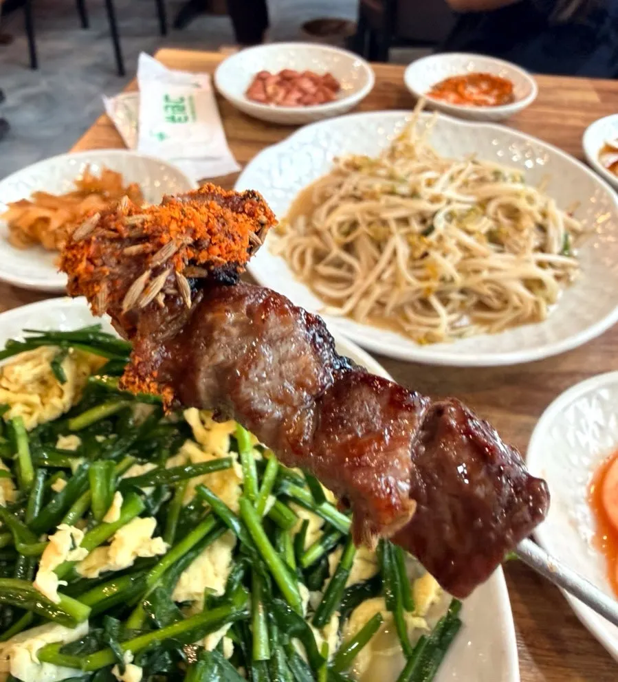 Close-up of a lamb skewer cooked to a golden brown