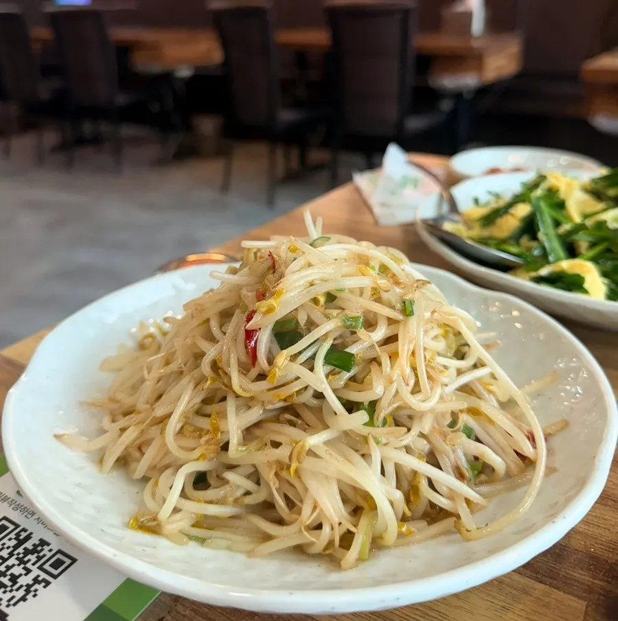 A heaping complimentary plate of bean sprout stir-fry