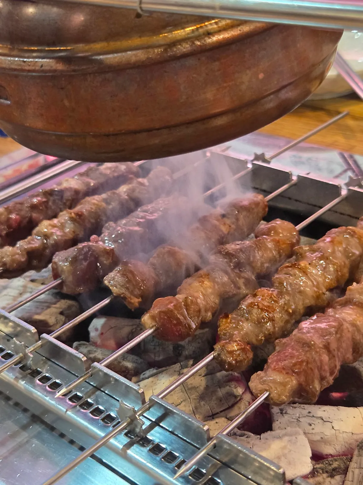 Close-up of nicely browned, well-grilled lamb skewers