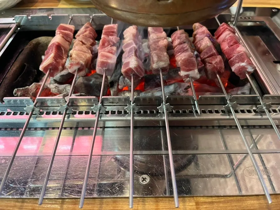 One serving of lamb skewers cut into cubes