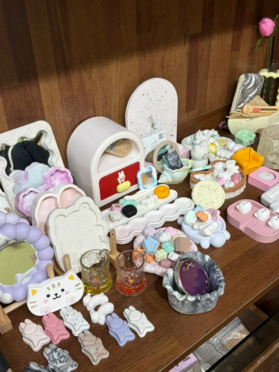 Resin keyring pieces displayed in the studio