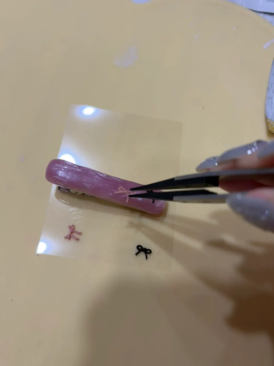 Wax shaped and placed on top of the hairpin
