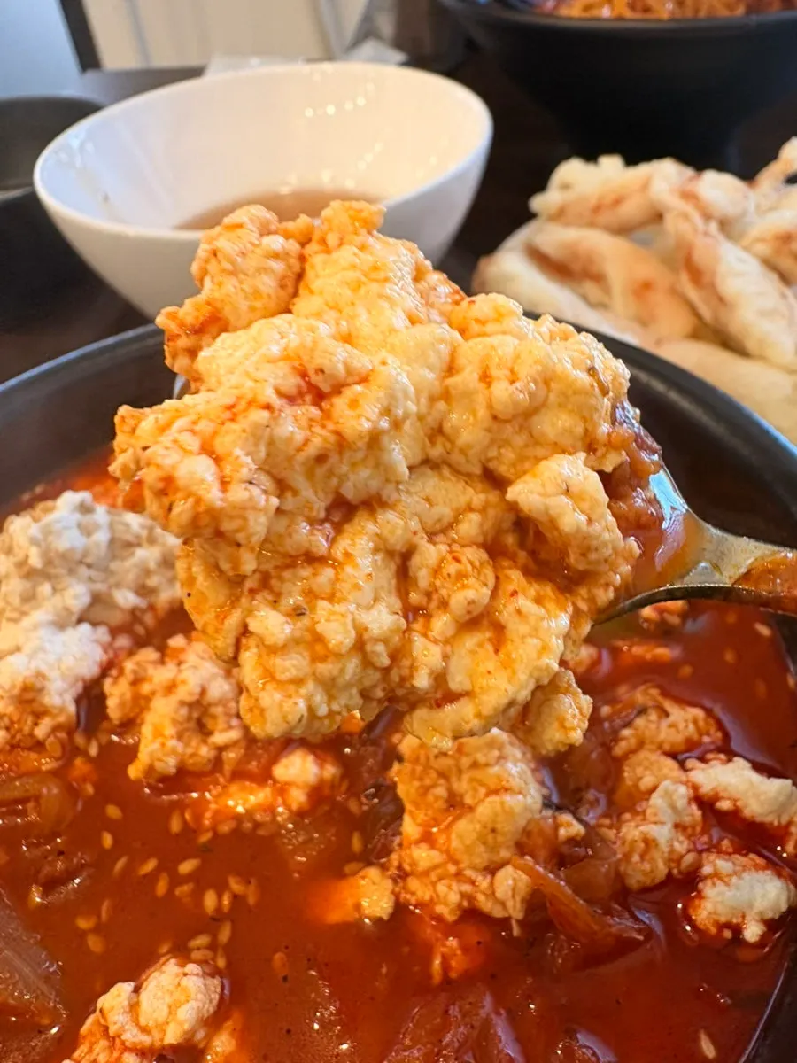 Mixing rice into the sundubu jjamppong rice broth
