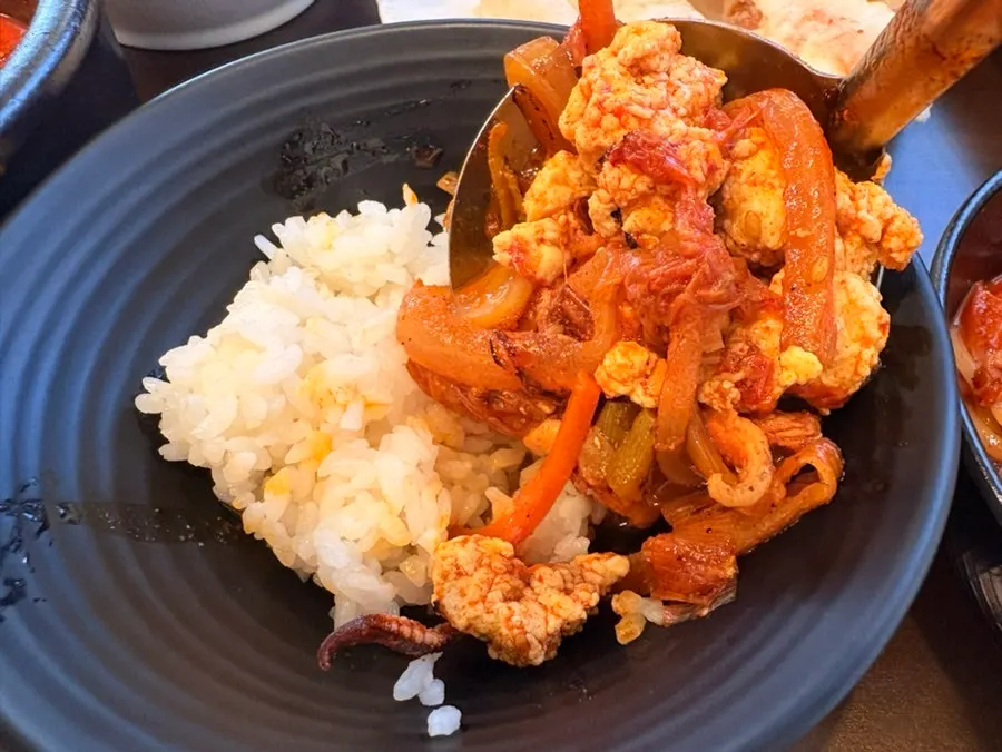 Sundubu jjamppong rice served with a bowl of rice