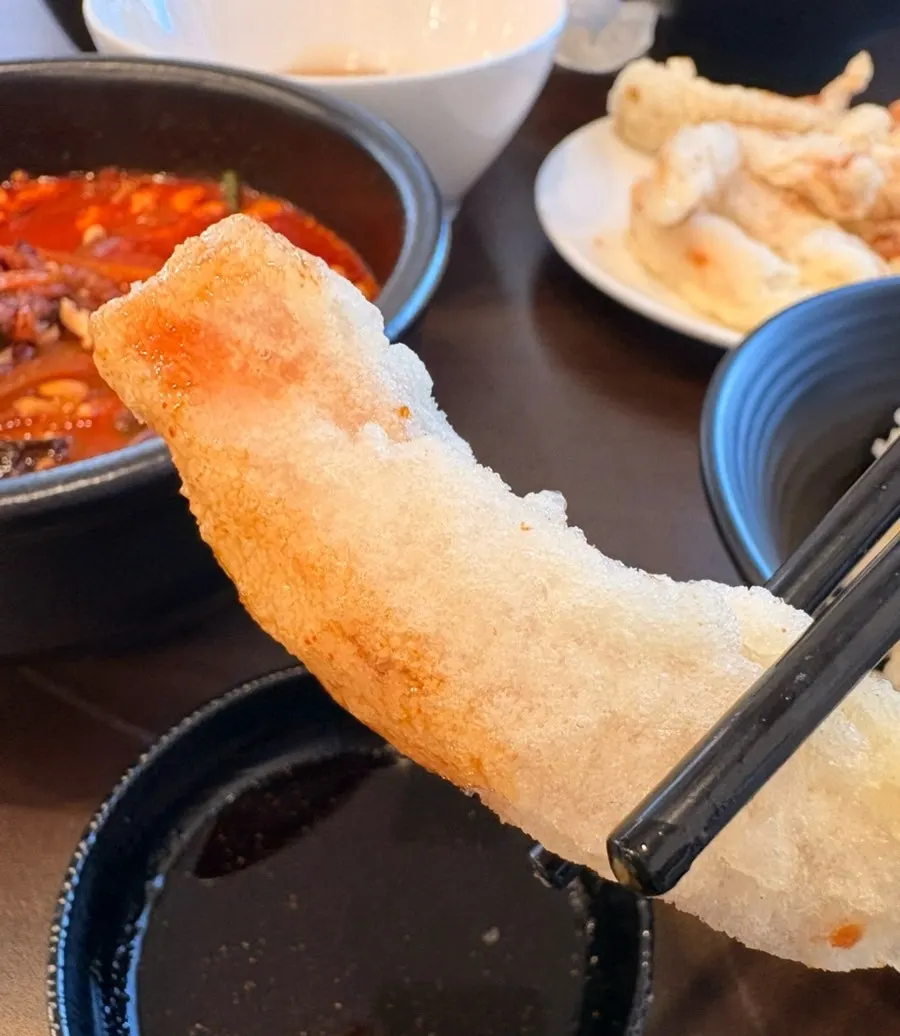 A piece of onion dipped in chunjang