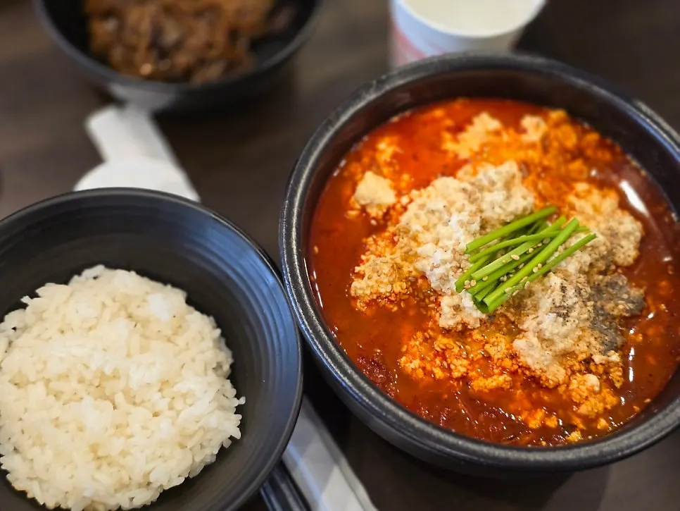 Sundubu jjamppong broth in an earthenware bowl