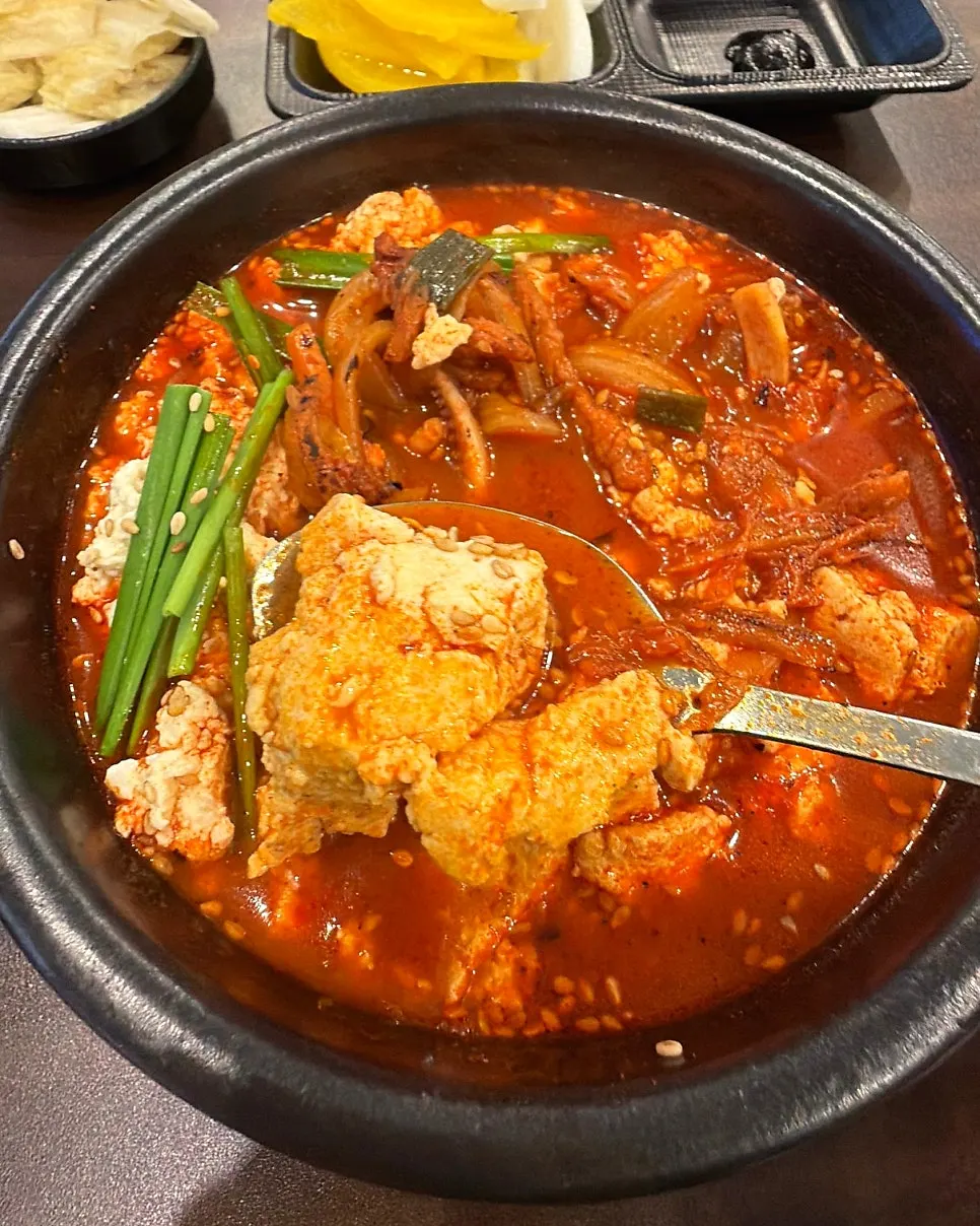 Red jjambbong broth packed with seafood