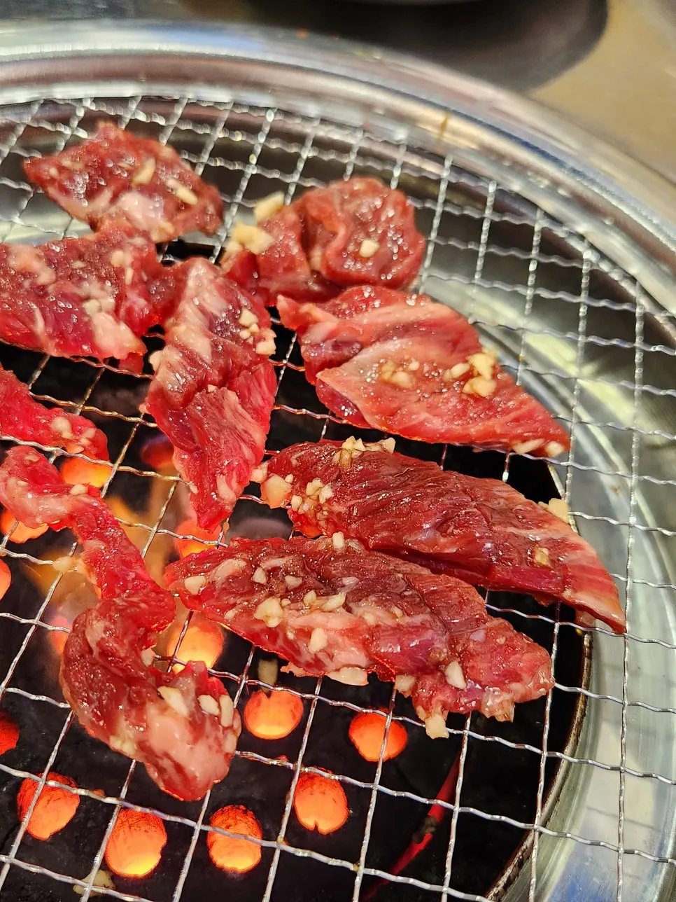 Garlic sogalbisal placed on the charcoal grill