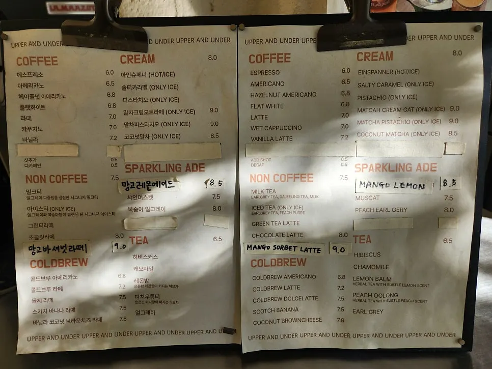 Drink menu board at Upper and Under