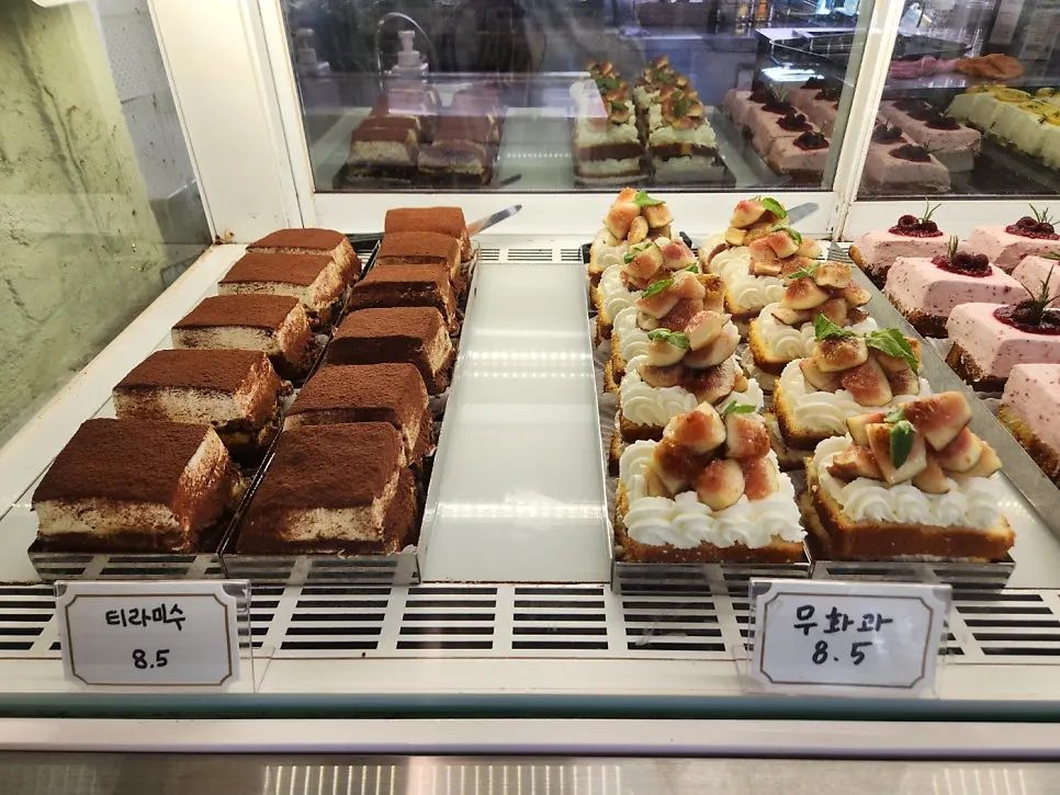 Display case with fig-topped desserts