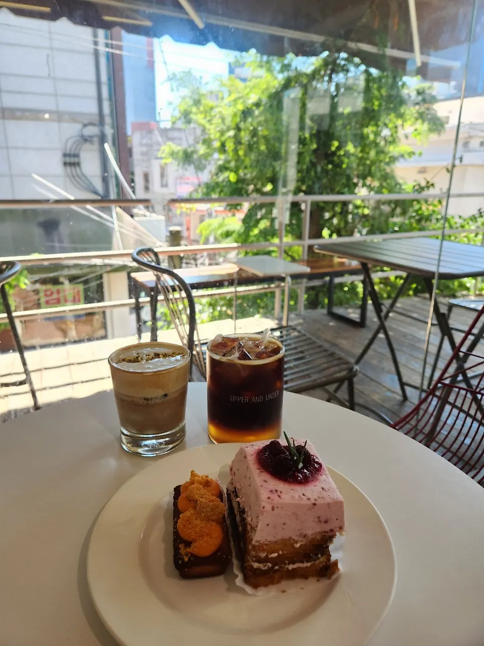 Scooping up a bite of raspberry cake slice with a fork