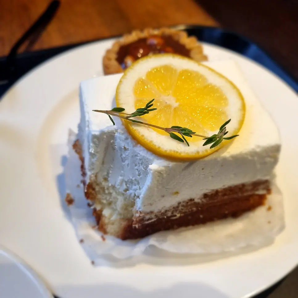 Cross-section of the lemon cream cake showing its thick cream layer