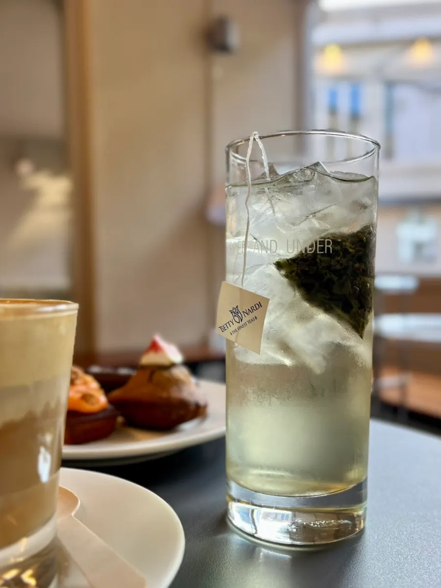 A cup of peach oolong tea at Upper and Under
