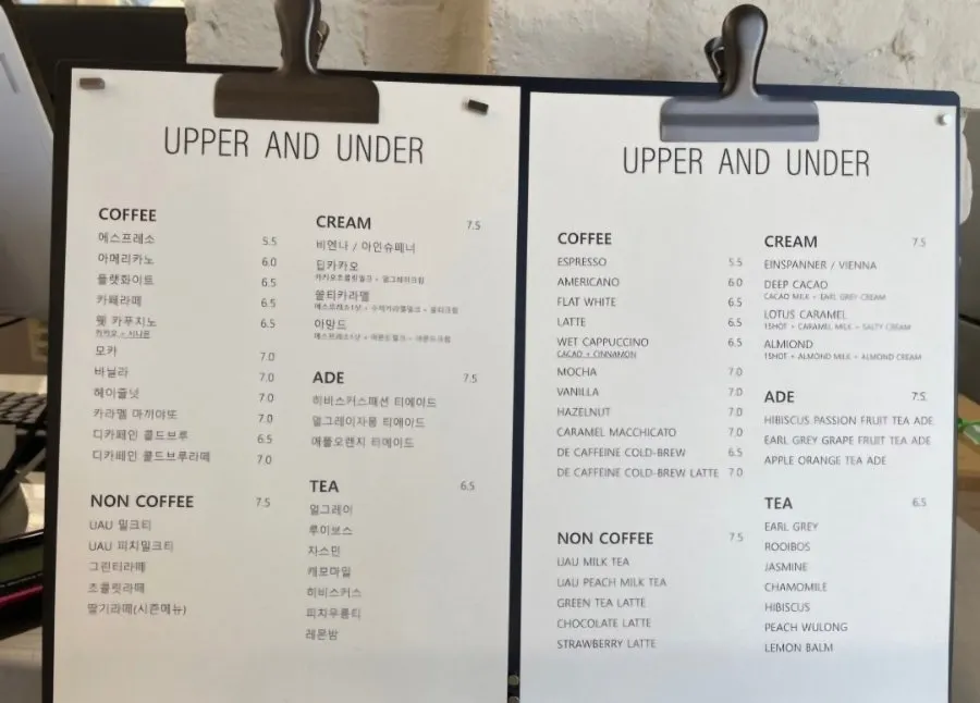 Self-serve water and paper cups set up in a corner of the café