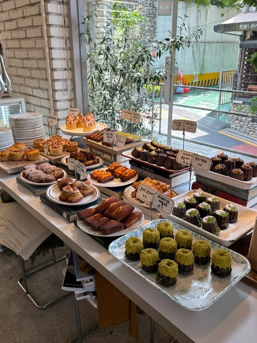 Display case packed with pastries and desserts