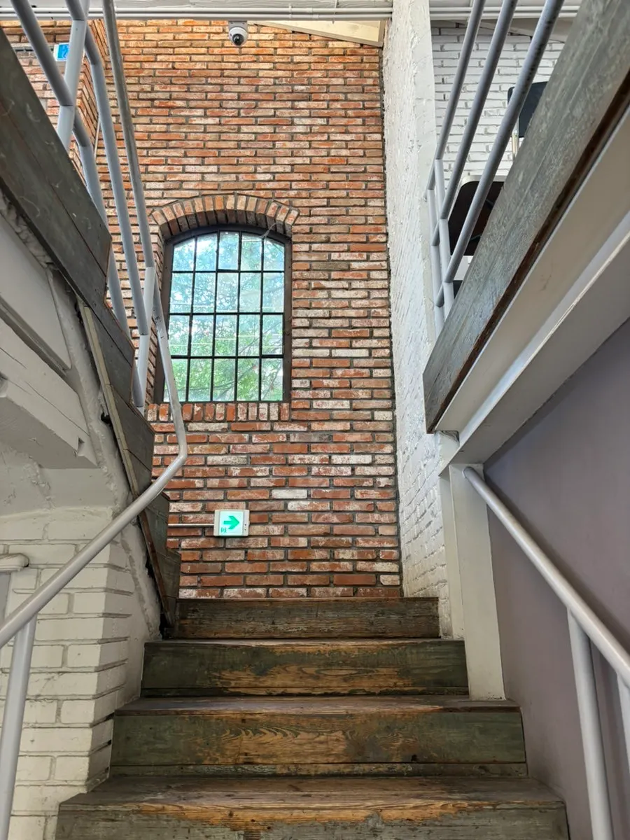 Staircase connecting the floors at Upper and Under