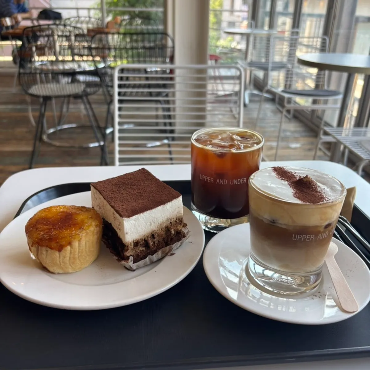 Table spread of tiramisu pound cake, crème brûlée flan and einspänner