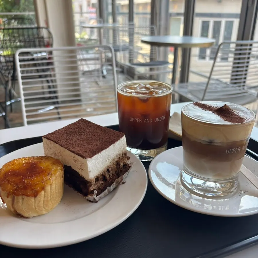 Two dessert plates and coffee on the table