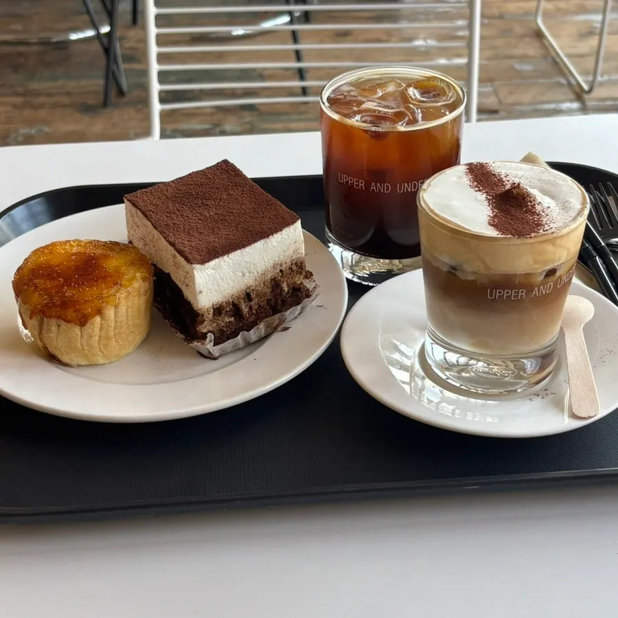 Two desserts with two cups of coffee