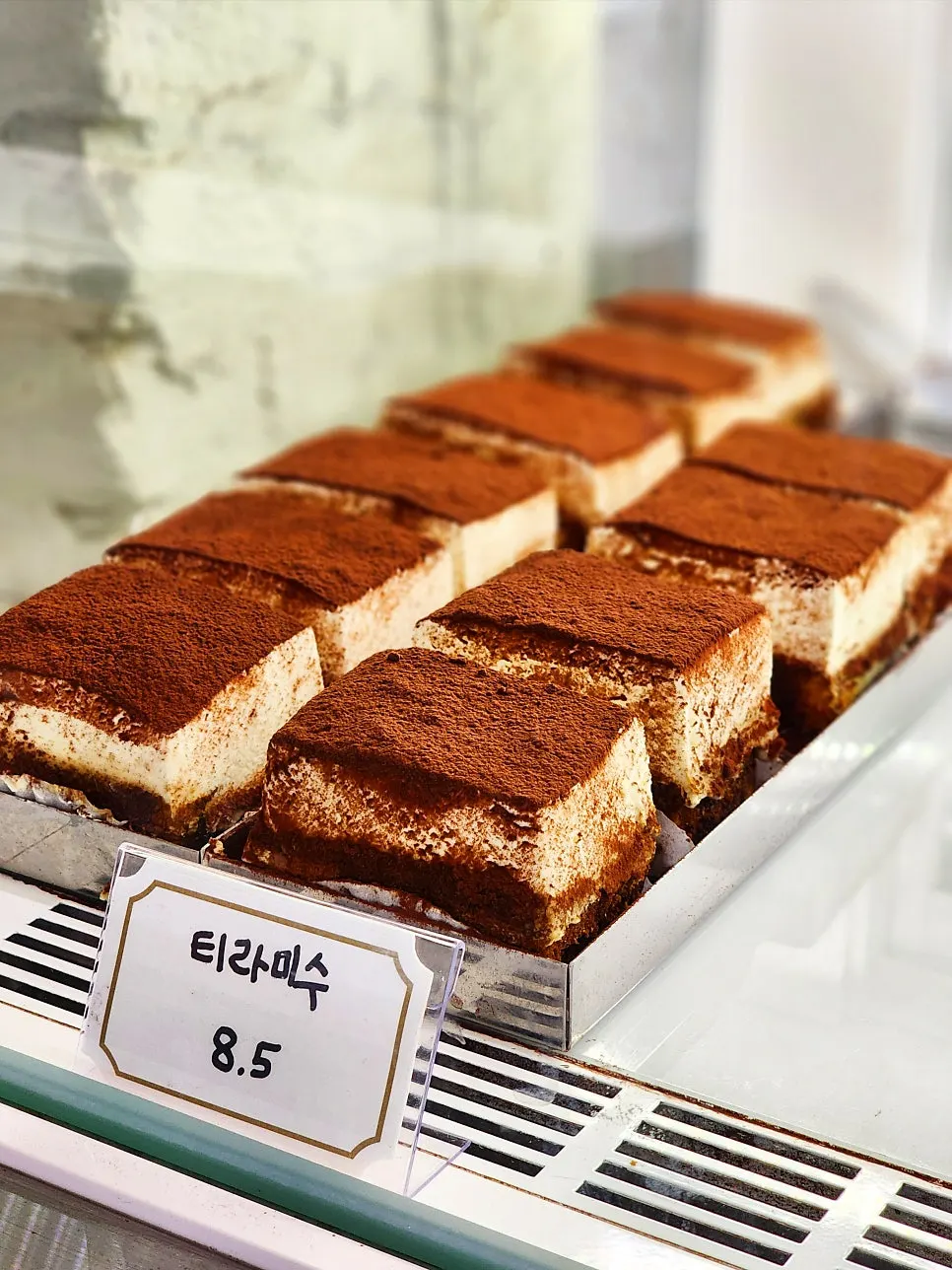 Lineup of mini fruit cakes inside the showcase