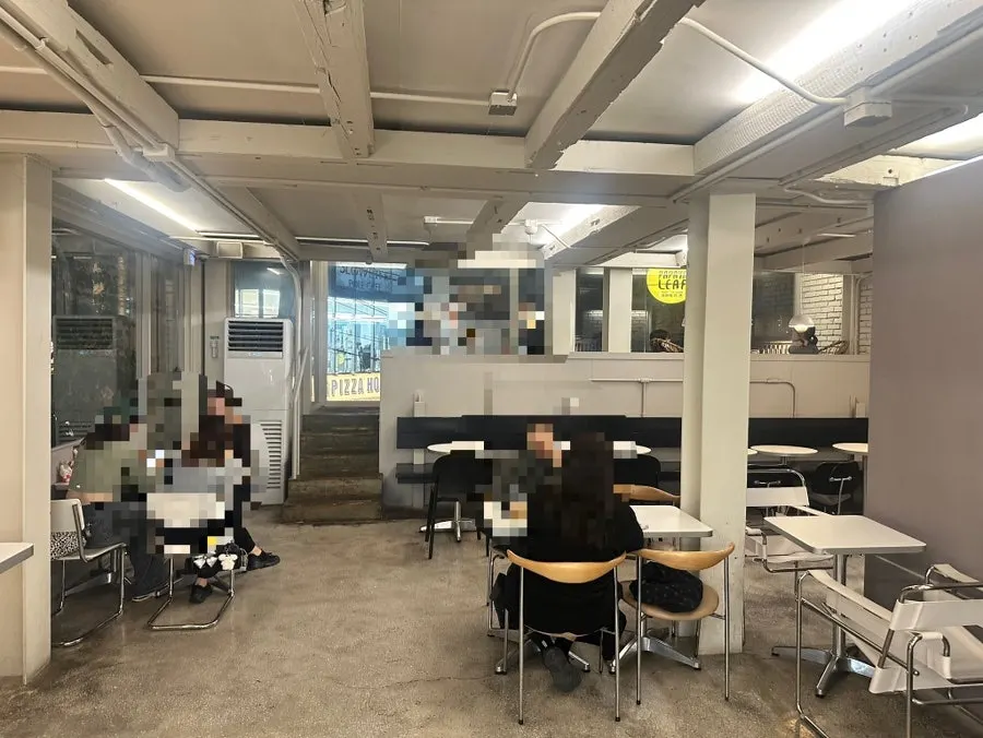 Cafe interior with generously spaced tables