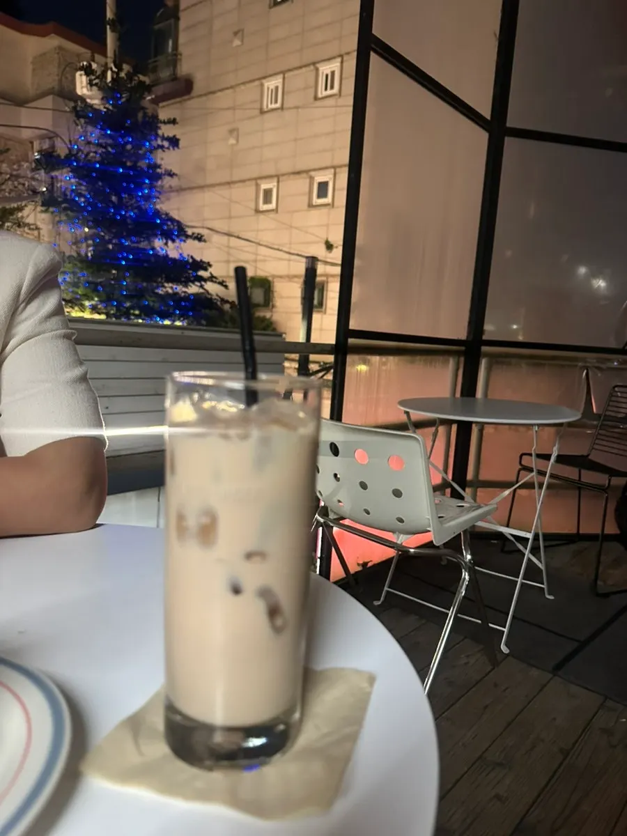Holding a glass of milk tea