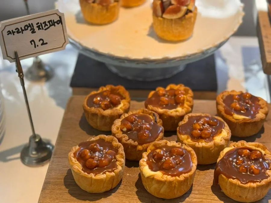 Baked goods display including canelé and financiers