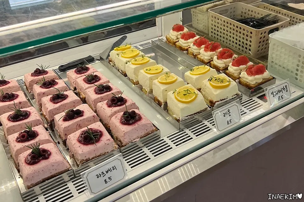 Display case with tarts and slice cakes