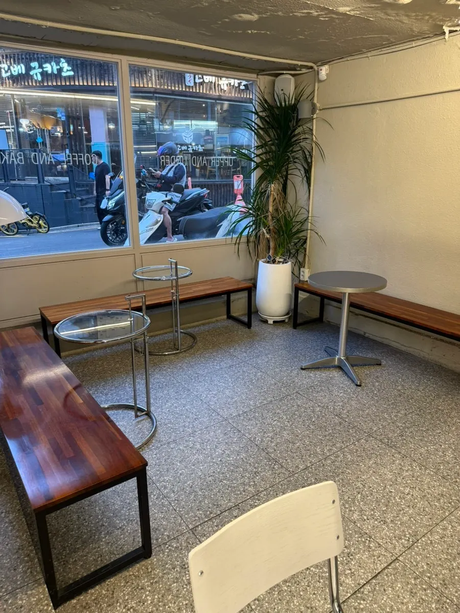 1st floor seating by floor-to-ceiling windows at Upper and Under