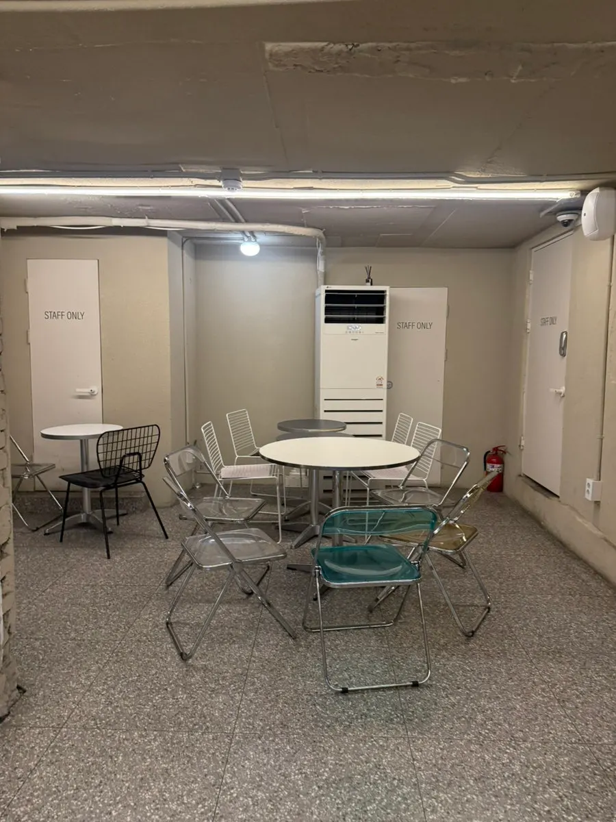 1st floor group seating and large table for meetups at Upper and Under