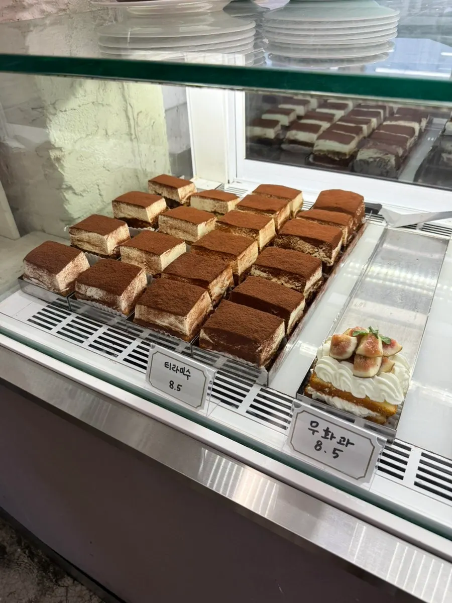 Slices of cake in Upper and Under's dessert showcase