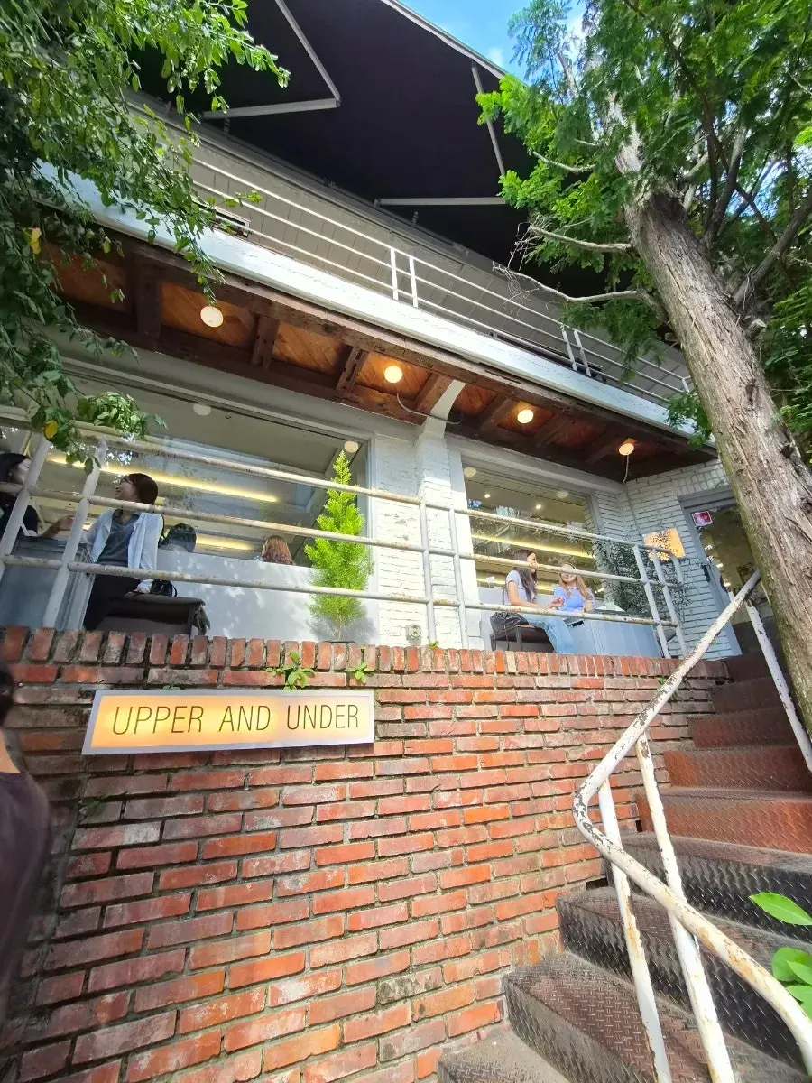 Upper and Under's entrance and UPPER AND UNDER sign
