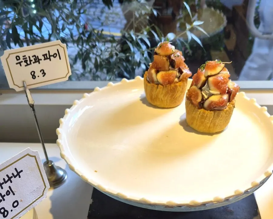 Dessert showcase displaying financiers and canelés