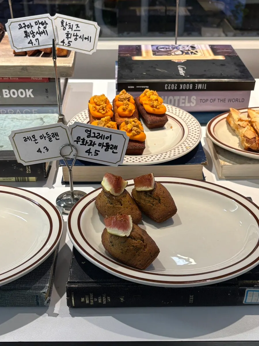 Dessert display case with pies and financiers