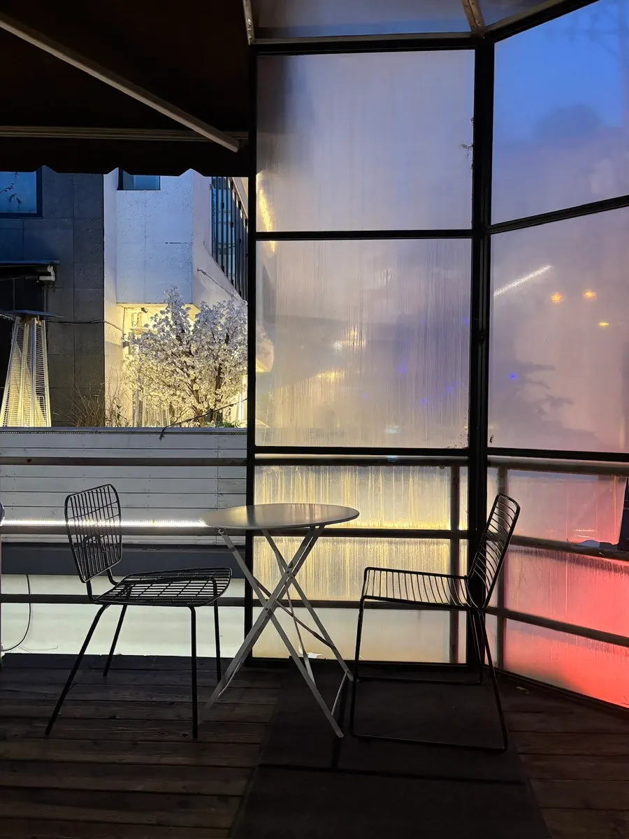 View of the terrace lined with several tables
