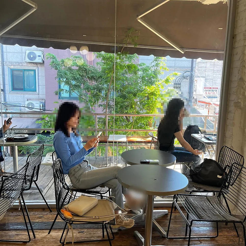 Indoor 3rd-floor seating at Upper and Under, connected to the terrace