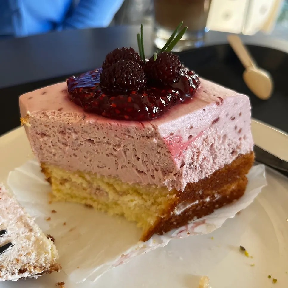 Cross-section of raspberry cake cut with a fork