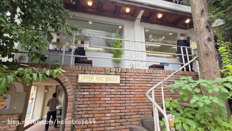 Outdoor terrace seating at Upper and Under