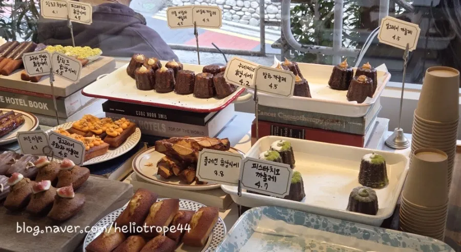 Bakery corner at Upper and Under with financiers and canelés on display