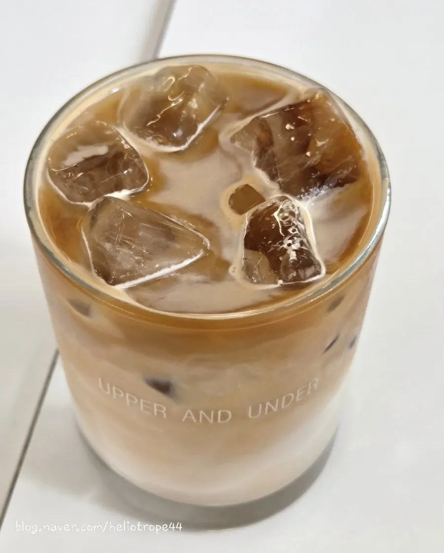 Iced café latte and tiramisu together at the window table