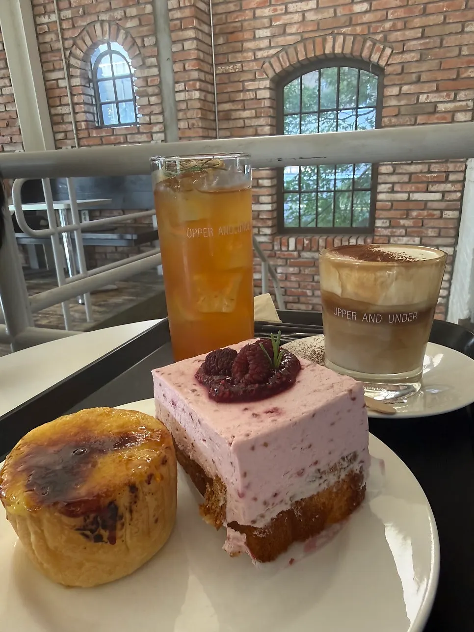 Desserts and drinks together on a table at Upper and Under