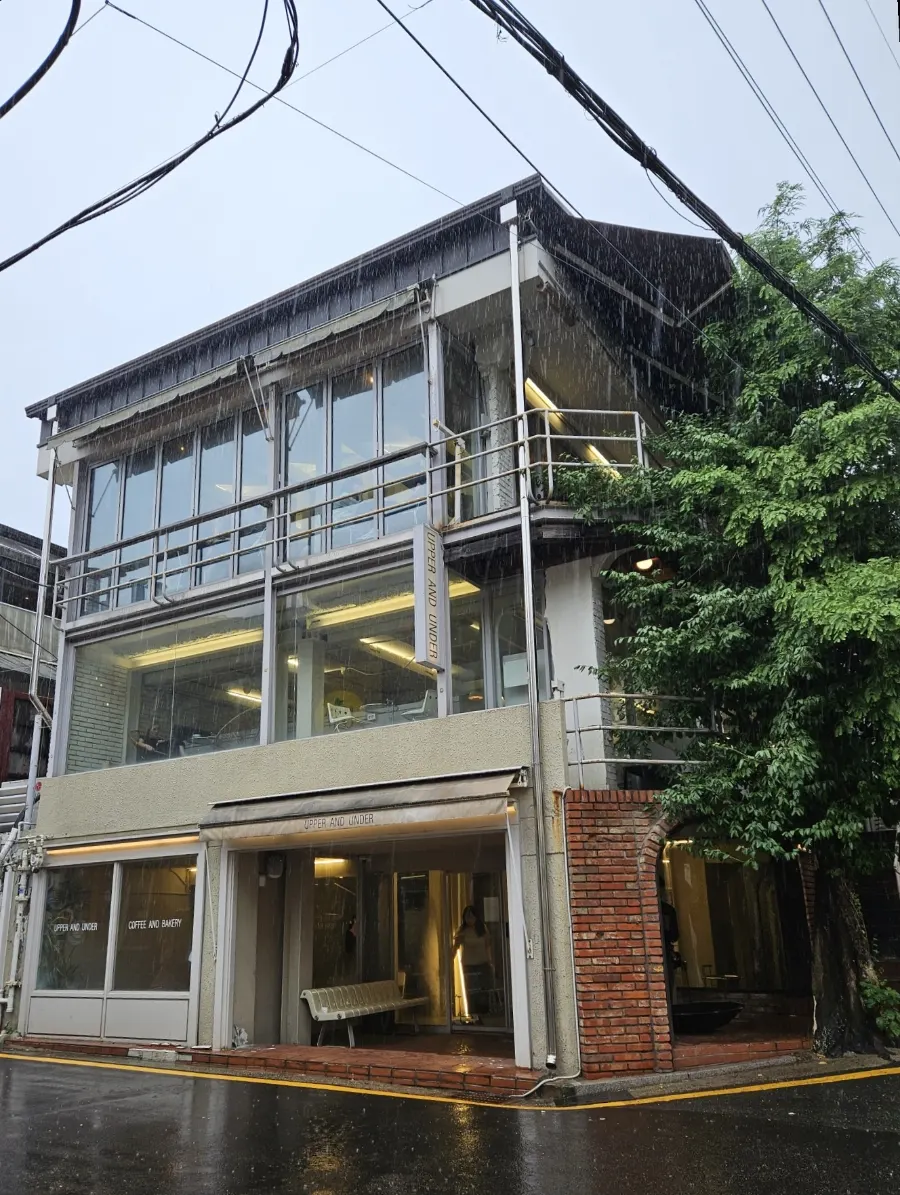 Floor-to-ceiling window exterior of Upper and Under