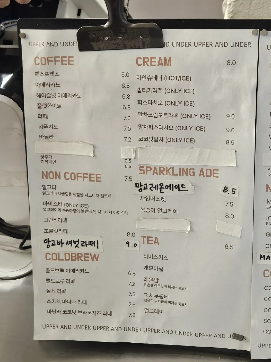 Coffee and drink menu board at Upper and Under
