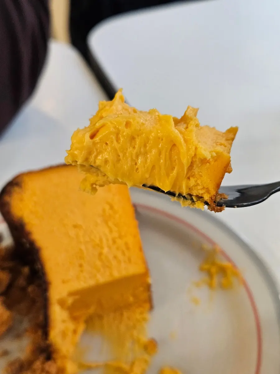 Cross-section of the dense honey cheese Basque cheesecake