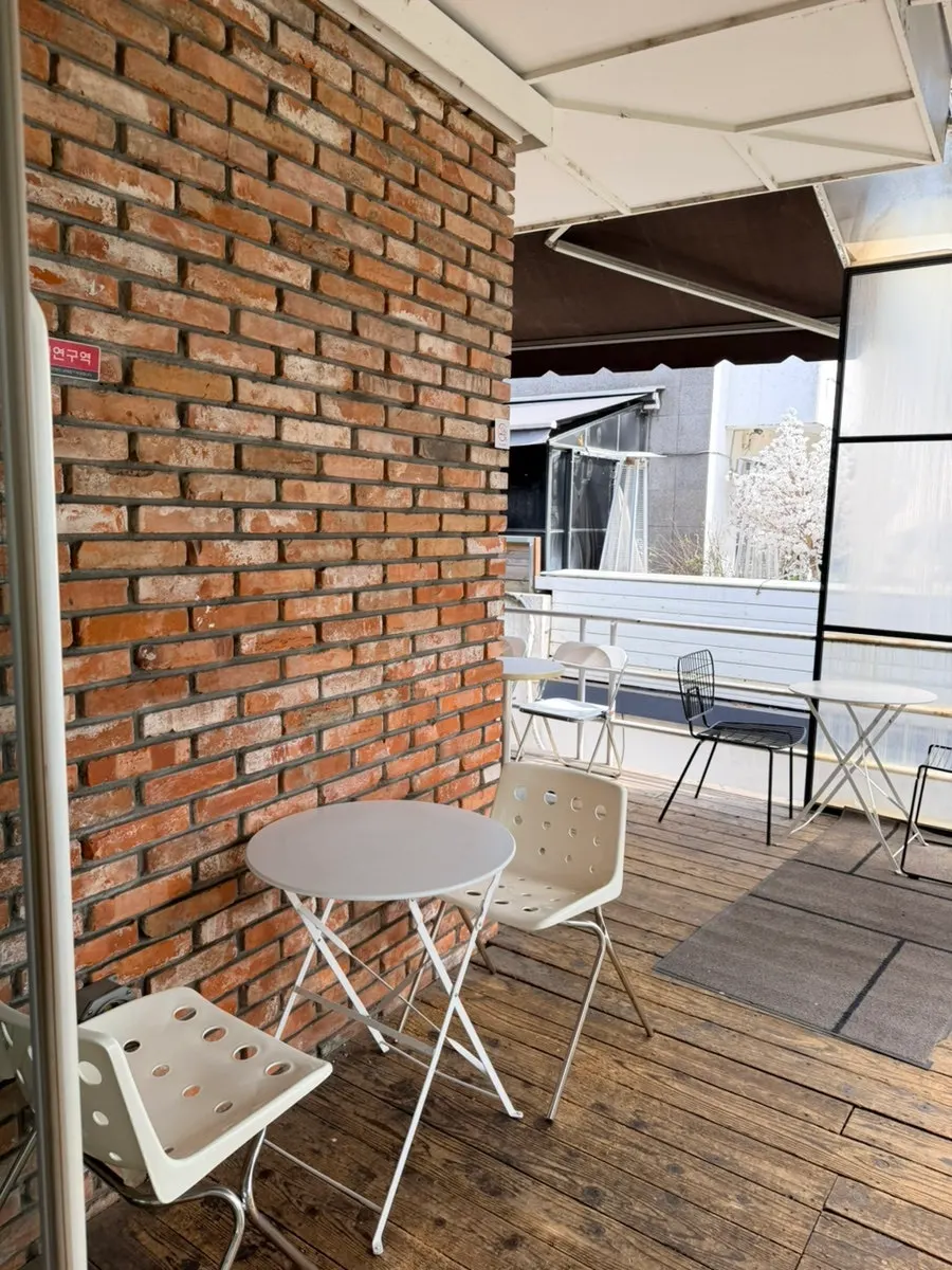 Outdoor terrace seating on the 2nd floor of Upper and Under