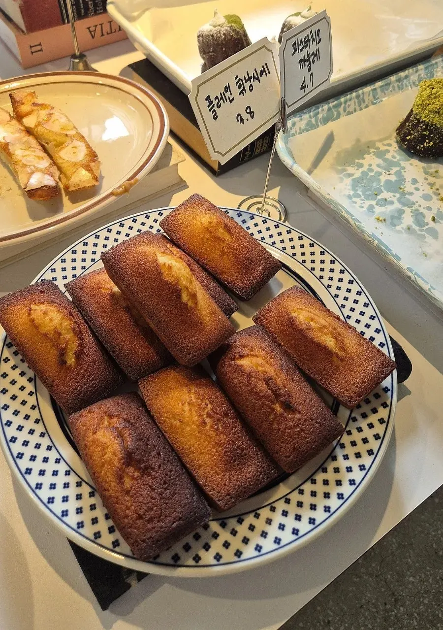 Baked goods and cakes on display at Upper and Under
