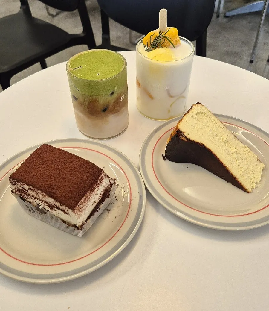 Four drinks and desserts set out on the table