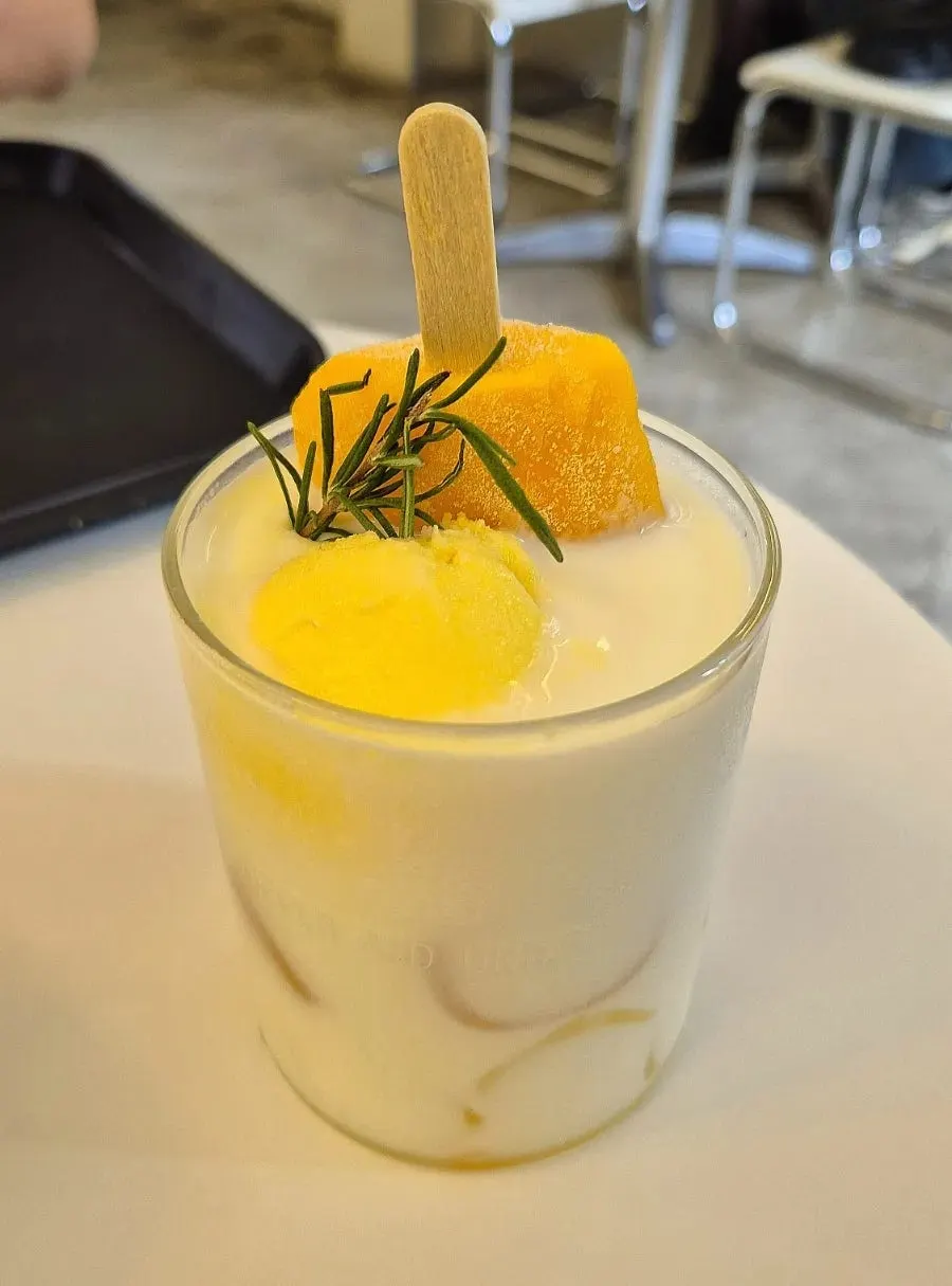 Close-up of the mango bar sherbet latte before mixing