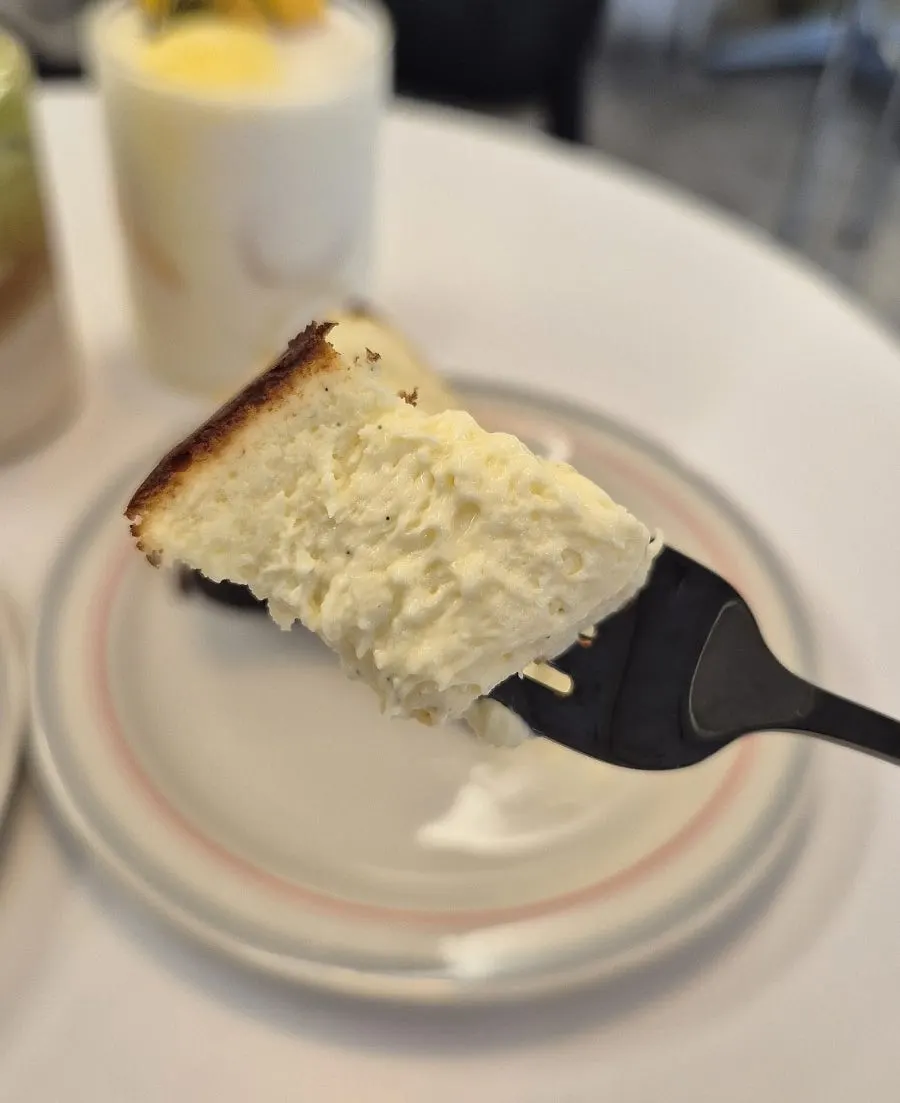 Cross-section of the Basque cheesecake cut with a fork