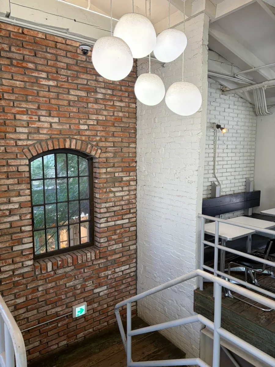 Sunlit indoor window seating at Upper and Under